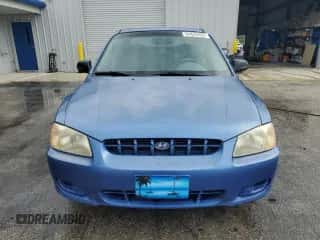 2002 Hyundai Accent GL z VIN KMHCG45C52U288494, wystawiony jako Copart lot #64835465 z przebiegiem 124 538 mil mil oraz Szkoda całkowita • Salvage title. Historia ofert i sprzedaży dostępna na DreamBid. Obrazek 5.