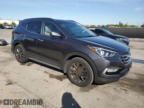 ✅ 2017 Hyundai Santa Fe Ultimate • VIN: 5XYZWDLA2HG502449 • Lot: 92265415. Listed on Copart with 25,648 mi. Free auction sales archive from the USA and detailed vehicle history report at DreamBid. Image 4.