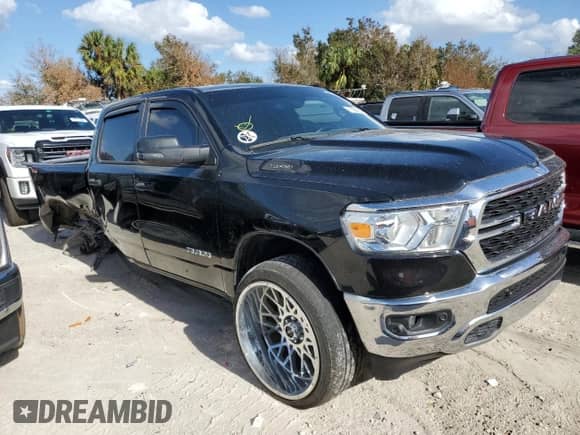 2023 Ram 1500 Lone Star with VIN 1C6RREMT8PN565793, listed as a Copart auction lot 77084184 with 18,825 mi miles and Salvage title. Bid and sale history available at DreamBid. Image 4.