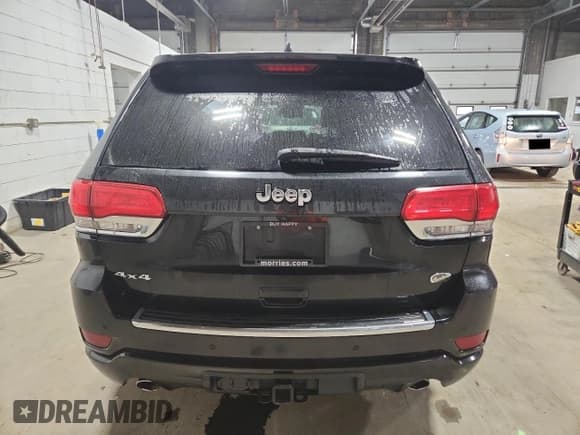 ✅ 2014 Jeep Grand Cherokee Overland • VIN: 1C4RJFCG9EC339863 • Lot: 90741315. Listed on Copart with 143,485 mi. Free auction sales archive from the USA and detailed vehicle history report at DreamBid. Image 6.