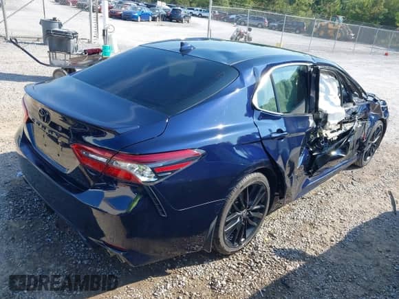 2021 Toyota Camry XSE with VIN 4T1K61AK4MU615383, listed as a IAAI auction lot 43193305 with 57,706 mi miles and . Bid and sale history available at DreamBid. Image 4.