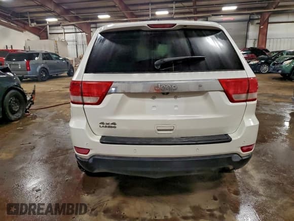 ✅ 2013 Jeep Grand Cherokee Laredo • VIN: 1C4RJFAG0DC582088 • Lot: 94437975. Listed on Copart with 136,143 mi. Free auction sales archive from the USA and detailed vehicle history report at DreamBid. Image 6.