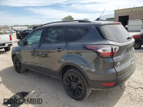 2018 Ford Escape SE z VIN 1FMCU9GD6JUD48647, wystawiony jako Copart lot #70868345 z przebiegiem 102 072 mil mil oraz Szkoda całkowita • Salvage title. Historia ofert i sprzedaży dostępna na DreamBid. Obrazek 2.