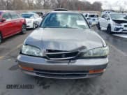 ✅ 1997 Acura TL • VIN: JH4UA3647VC005677 • Lot: 41805388. Listed on IAAI with 288,545 mi. Free auction sales archive from the USA and detailed vehicle history report at DreamBid. Image 12.