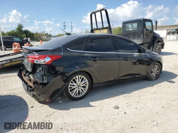 ✅ 2015 Ford Focus Titanium • VIN: 1FADP3J20FL260717 • Лот: 81869835. Опубликован ранее на Copart с пробегом 134 725 миль. Бесплатный доступ к архиву аукционных продаж из США и подробный отчёт об истории автомобиля на DreamBid. Изображение 3.