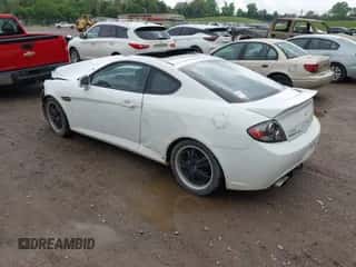 2007 Hyundai Tiburon GT с VIN KMHHN66F17U245469, выставлен на аукционе IAAI как лот 42065200 с пробегом 209 049 миль миль и . История ставок и продаж доступна на DreamBid. Изображение 3.