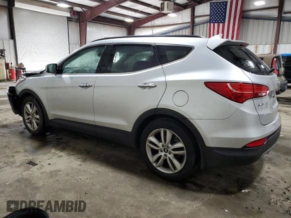 ✅ 2016 Hyundai Santa Fe • VIN: 5XYZWDLA6GG310806 • Лот: 65926384. Опубликован ранее на Copart с пробегом 90 310 миль. Бесплатный доступ к архиву аукционных продаж из США и подробный отчёт об истории автомобиля на DreamBid. Изображение 2.