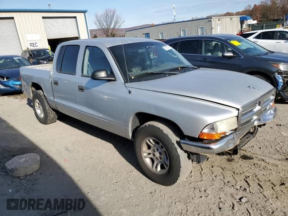 2004 Dodge Dakota SLT z VIN 1D7HL48K24S721847, wystawiony jako Copart lot #77673774 z przebiegiem Nie podano mil oraz Szkoda całkowita • Salvage title. Historia ofert i sprzedaży dostępna na DreamBid. Obrazek 4.