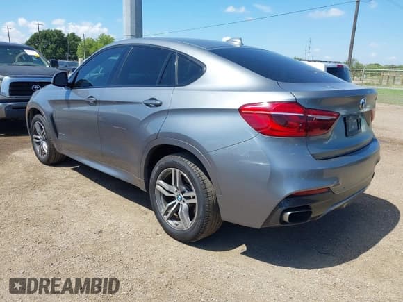 ✅ 2015 BMW X6 xDrive50i • VIN: 5UXKU6C54F0F93945 • Lot: 43042471. Listed on IAAI with 52,434 mi. Free auction sales archive from the USA and detailed vehicle history report at DreamBid. Image 3.