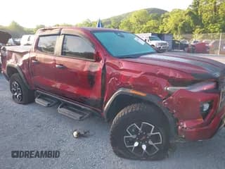 ✅ 2023 GMC Canyon 4WD AT4X • VIN: 1GTP6EEK9P1153310 • Лот: 42558790. Опубликован ранее на IAAI с пробегом 11 715 миль. Бесплатный доступ к архиву аукционных продаж из США и подробный отчёт об истории автомобиля на DreamBid. Изображение 1.