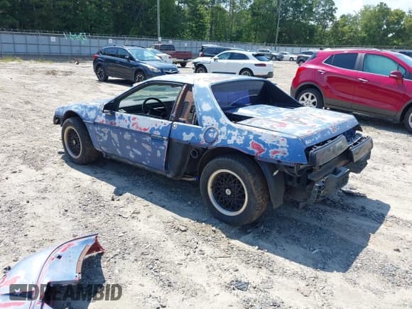 ✅ 1988 Pontiac Fiero • VIN: 1G2PE11R7JP201894 • Lot: 42888841. Listed on IAAI with Not provided. Free auction sales archive from the USA and detailed vehicle history report at DreamBid. Image 3.