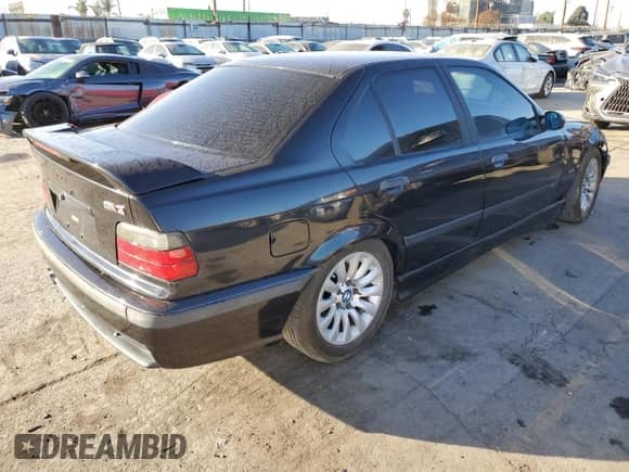 1998 BMW 3 Series M3s with VIN WBSCD932XWEE08919, listed as a Copart auction lot 84434704 with Not provided miles and Salvage title. Bid and sale history available at DreamBid. Image 3.