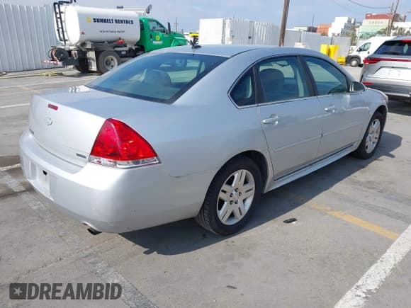 ✅ 2014 Chevrolet Impala LT • VIN: 2G1WB5E31E1100066 • Lot: 42240075. Listed on IAAI with 175,209 mi. Free auction sales archive from the USA and detailed vehicle history report at DreamBid. Image 4.