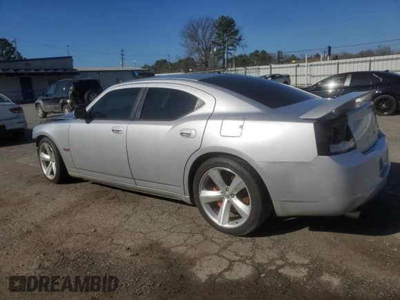 2009 Dodge Charger SRT-8 с VIN 2B3LA73W09H610039, выставлен на аукционе Copart как лот 86885314 с пробегом Не указан миль и Списание • Salvage title. История ставок и продаж доступна на DreamBid. Изображение 2.