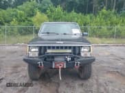 ✅ 1987 Jeep Cherokee • VIN: 1JCMR7819HT174249 • Lot: 42458110. Listed on IAAI with 157,683 mi. Free auction sales archive from the USA and detailed vehicle history report at DreamBid. Image 12.