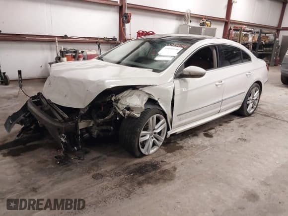 ✅ 2014 Volkswagen CC Executive • VIN: WVWRP7AN9EE519502 • Lot: 41458158. Listed on IAAI with 85,988 mi. Free auction sales archive from the USA and detailed vehicle history report at DreamBid. Image 2.