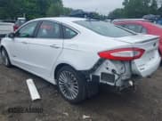 ✅ 2013 Ford Fusion Titanium Hybrid • VIN: 3FA6P0RU6DR315585 • Lot: 42598359. Listed on IAAI with 153,669 mi. Free auction sales archive from the USA and detailed vehicle history report at DreamBid. Image 3.