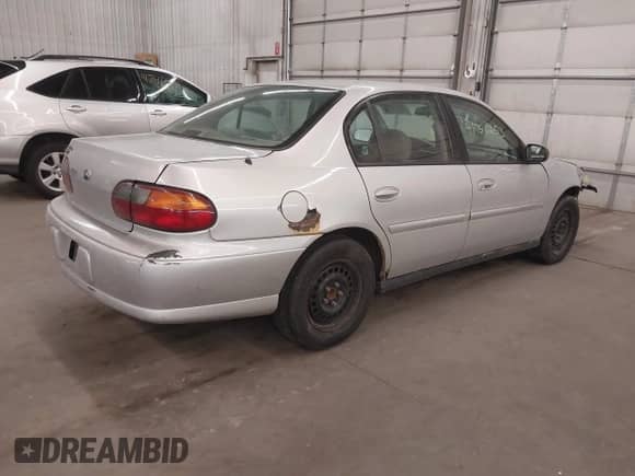 2003 Chevrolet Malibu z VIN 1G1ND52J73M536270, wystawiony jako IAAI lot #41750653 z przebiegiem 128 005 mil mil oraz . Historia ofert i sprzedaży dostępna na DreamBid. Obrazek 4.