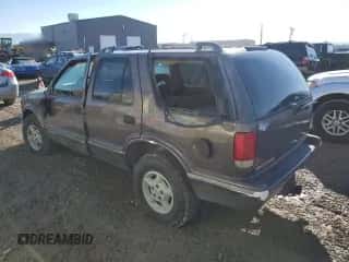 1997 Chevrolet Blazer LS z VIN 1GNDT13WXVK246877, wystawiony jako Copart lot #80308224 z przebiegiem 164 149 mil mil oraz Szkoda całkowita • Salvage title. Historia ofert i sprzedaży dostępna na DreamBid. Obrazek 2.