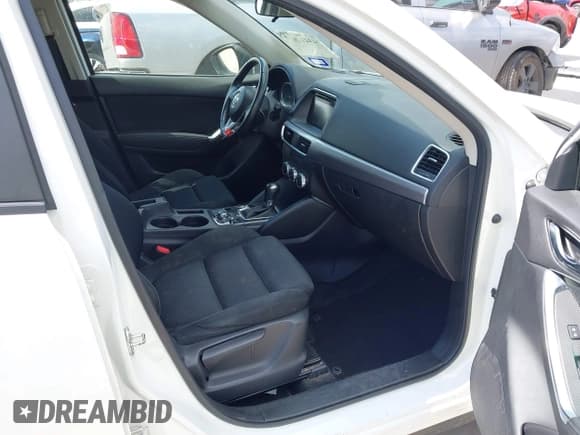 ✅ 2016 Mazda CX-5 Touring • VIN: JM3KE2CY0G0694939 • Lot: 43401057. Wystawiony na IAAI z przebiegiem 125 867 mil. Bezpłatny archiwum sprzedaży aukcyjnych z USA i szczegółowy raport historii pojazdu na DreamBid. Zdjęcie 5.