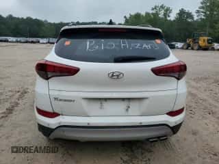 2018 Hyundai Tucson Value z VIN KM8J33A20JU667489, wystawiony jako Copart lot #68116045 z przebiegiem Nie podano mil oraz Szkoda całkowita • Salvage title. Historia ofert i sprzedaży dostępna na DreamBid. Obrazek 6.