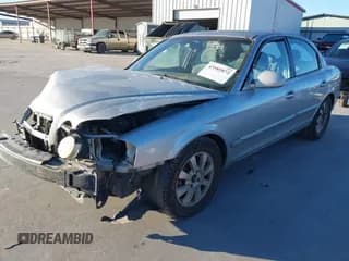 ✅ 2006 Kia Optima LX • VIN: KNAGD128265441729 • Лот: 43585872. Опубликован ранее на IAAI с пробегом 165 377 миль. Бесплатный доступ к архиву аукционных продаж из США и подробный отчёт об истории автомобиля на DreamBid. Изображение 2.