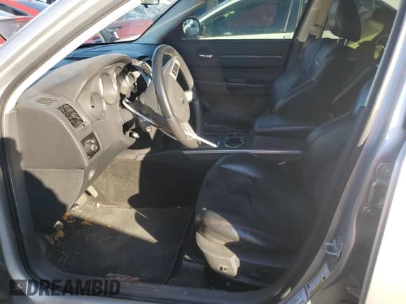 2009 Dodge Charger SRT-8 с VIN 2B3LA73W09H610039, выставлен на аукционе Copart как лот 86885314 с пробегом Не указан миль и Списание • Salvage title. История ставок и продаж доступна на DreamBid. Изображение 7.