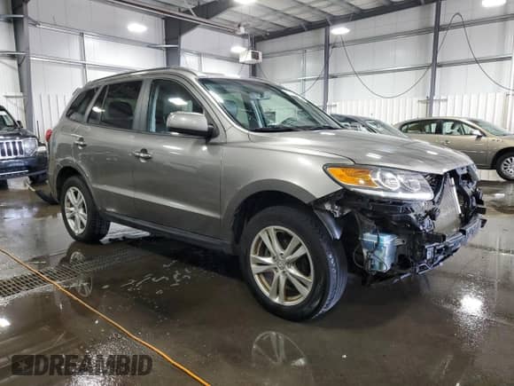 2012 Hyundai Santa Fe Limited с VIN 5XYZKDAGXCG152385, выставлен на аукционе Copart как лот 63775244 с пробегом 149 243 миль миль и Списание • Salvage title. История ставок и продаж доступна на DreamBid. Изображение 4.