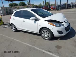 ✅ 2012 Mazda 2 Sport • VIN: JM1DE1KZ1C0145993 • Lot: 42863424. Listed on IAAI with 118,650 mi. Free auction sales archive from the USA and detailed vehicle history report at DreamBid. Image 1.