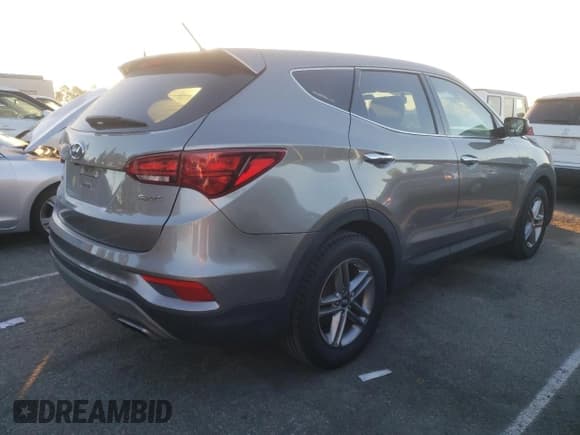 ✅ 2018 Hyundai Santa Fe 2.4L • VIN: 5XYZT3LB0JG541252 • Лот: 71898762. Опубликован ранее на Copart с пробегом 104 475 миль. Бесплатный доступ к архиву аукционных продаж из США и подробный отчёт об истории автомобиля на DreamBid. Изображение 3.