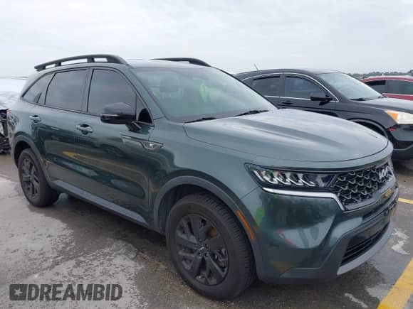 2022 Kia Sorento X-Line S z VIN 5XYRLDLC9NG129612, wystawiony jako IAAI lot #42669526 z przebiegiem 51 432 mil mil oraz . Historia ofert i sprzedaży dostępna na DreamBid. Obrazek 1.