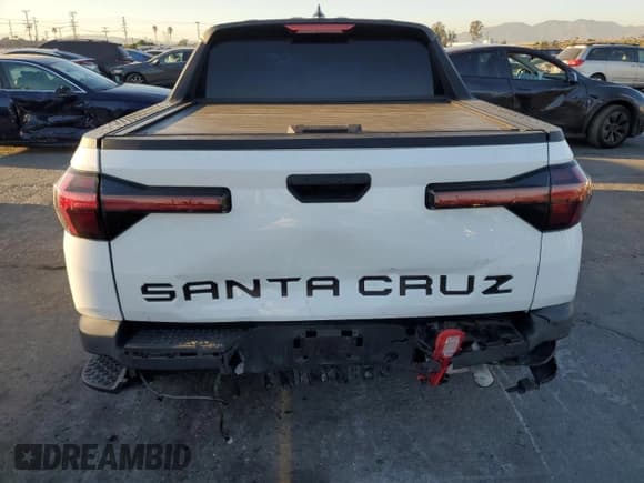 ✅ 2022 Hyundai Santa Cruz SEL • VIN: 5NTJBDAE5NH001866 • Lot: 90853285. Listed on Copart with 49,387 mi. Free auction sales archive from the USA and detailed vehicle history report at DreamBid. Image 6.