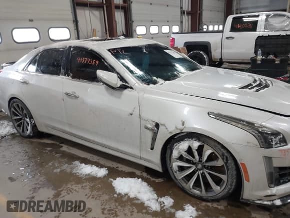 ✅ 2016 Cadillac CTS-V • VIN: 1G6A15S61G0163785 • Lot: 41377359. Listed on IAAI with 73,528 mi. Free auction sales archive from the USA and detailed vehicle history report at DreamBid. Image 13.