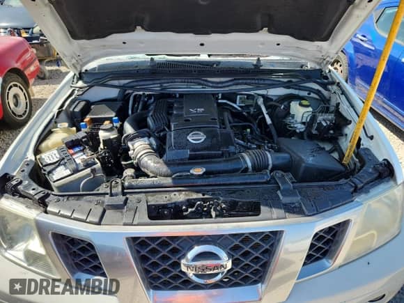 2014 Nissan Frontier Desert Runner z VIN 1N6AD0ER7EN754973, wystawiony jako Copart lot #80178315 z przebiegiem 60 548 mil mil oraz Szkoda całkowita • Salvage title. Historia ofert i sprzedaży dostępna na DreamBid. Obrazek 11.