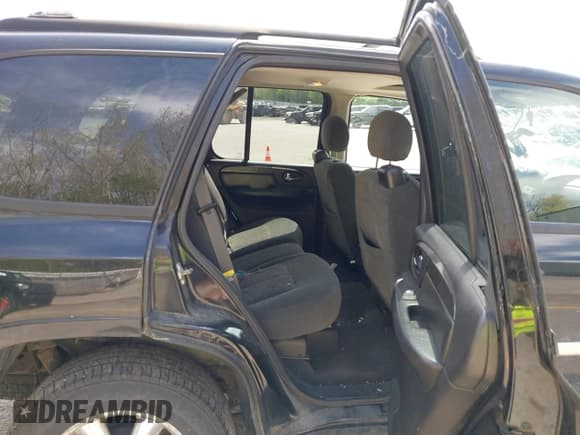 ✅ 2006 GMC Envoy SLE • VIN: 1GKDT13S562240769 • Lot: 42255973. Listed on IAAI with 183,423 mi. Free auction sales archive from the USA and detailed vehicle history report at DreamBid. Image 8.