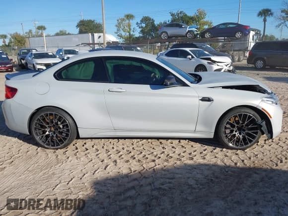 ✅ 2020 BMW M2 Competition • VIN: WBS2U7C01L7E29334 • Lot: 43299285. Listed on IAAI with 58,986 mi. Free auction sales archive from the USA and detailed vehicle history report at DreamBid. Image 13.