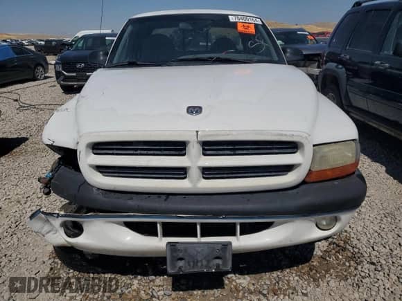 1999 Dodge Dakota SLT z VIN 1B7GL22Y6XS108819, wystawiony jako Copart lot #70400164 z przebiegiem Nie podano mil oraz Szkoda całkowita • Salvage title. Historia ofert i sprzedaży dostępna na DreamBid. Obrazek 5.