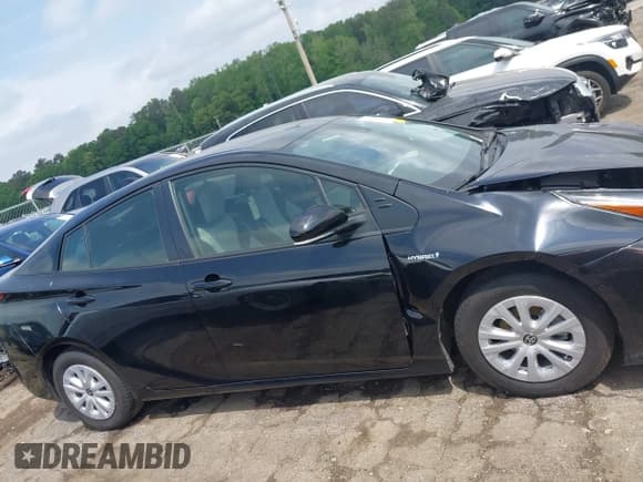 ✅ 2022 Toyota Prius L Eco • VIN: JTDKAMFU8N3181135 • Lot: 42098611. Listed on IAAI with 69,949 mi. Free auction sales archive from the USA and detailed vehicle history report at DreamBid. Image 13.