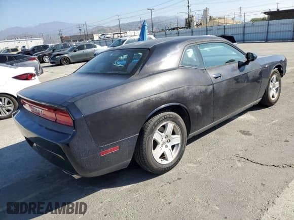 ✅ 2012 Dodge Challenger SXT Plus • VIN: 2C3CDYAG6CH124824 • Лот: 90899325. Опубликован ранее на Copart с пробегом 128 236 миль. Бесплатный доступ к архиву аукционных продаж из США и подробный отчёт об истории автомобиля на DreamBid. Изображение 3.