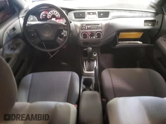 ✅ 2005 Mitsubishi Lancer ES • VIN: JA3AJ26E15U039534 • Lot: 63104055. Wystawiony na Copart z przebiegiem 34 899 mil. Bezpłatny archiwum sprzedaży aukcyjnych z USA i szczegółowy raport historii pojazdu na DreamBid. Zdjęcie 8.