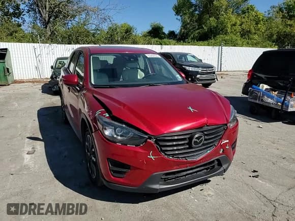 ✅ 2016 Mazda CX-5 Grand Touring • VIN: JM3KE4DY2G0676811 • Lot: 85204805. Wystawiony na Copart z przebiegiem 116 610 mil. Bezpłatny archiwum sprzedaży aukcyjnych z USA i szczegółowy raport historii pojazdu na DreamBid. Zdjęcie 13.