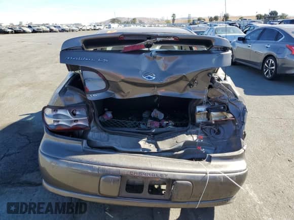 2001 Chevrolet Malibu LS z VIN 1G1NE52J516237620, wystawiony jako Copart lot #76809764 z przebiegiem 82 099 mil mil oraz Szkoda całkowita • Salvage title. Historia ofert i sprzedaży dostępna na DreamBid. Obrazek 6.