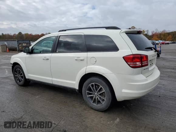 2018 Dodge Journey SE with VIN 3C4PDCAB3JT383151, listed as a Copart auction lot 82650255 with 118,936 mi miles and Salvage title. Bid and sale history available at DreamBid. Image 2.