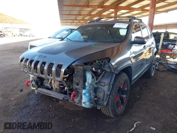 ✅ 2016 Jeep Cherokee Trailhawk • VIN: 1C4PJMBSXGW246224 • Lot: 43837921. Listed on IAAI with 104,876 mi. Free auction sales archive from the USA and detailed vehicle history report at DreamBid. Image 2.