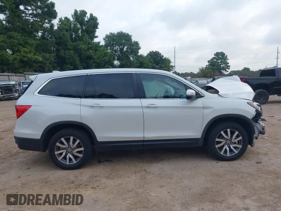 ✅ 2021 Honda Pilot EX-L • VIN: 5FNYF6H56MB025156 • Лот: 42706595. Опубликован ранее на IAAI с пробегом 92 419 миль. Бесплатный доступ к архиву аукционных продаж из США и подробный отчёт об истории автомобиля на DreamBid. Изображение 14.