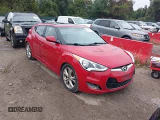 2012 Hyundai Veloster w/Gray Int z VIN KMHTC6AD1CU054540, wystawiony jako IAAI lot #43437087 z przebiegiem 173 534 mil mil oraz . Historia ofert i sprzedaży dostępna na DreamBid. Obrazek 1.