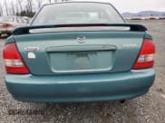 ✅ 2001 Mazda Protege LX • VIN: JM1BJ226510402231 • Lot: 46717595. Wystawiony na Copart z przebiegiem 154 138 mil. Bezpłatny archiwum sprzedaży aukcyjnych z USA i szczegółowy raport historii pojazdu na DreamBid. Zdjęcie 6.