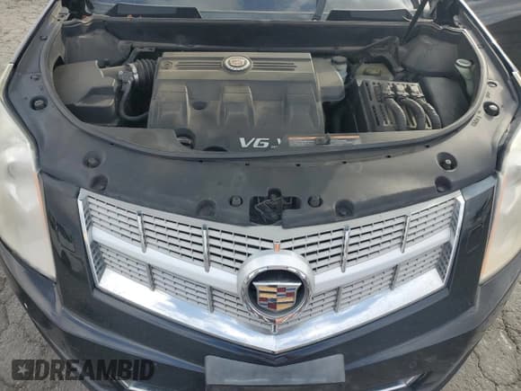 ✅ 2012 Cadillac SRX Performance Collection • VIN: 3GYFNBE31CS577198 • Lot: 81932555. Listed on Copart with 194,810 mi. Free auction sales archive from the USA and detailed vehicle history report at DreamBid. Image 12.