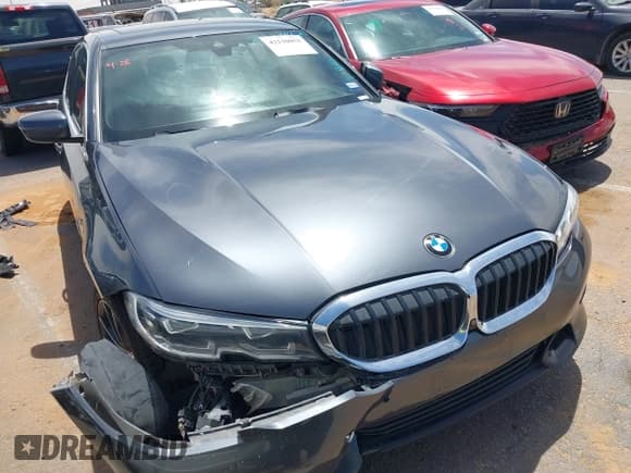 ✅ 2020 BMW 3 Series 330i • VIN: 3MW5R1J07L8B25648 • Lot: 42130052. Listed on IAAI with 64,662 mi. Free auction sales archive from the USA and detailed vehicle history report at DreamBid. Image 1.