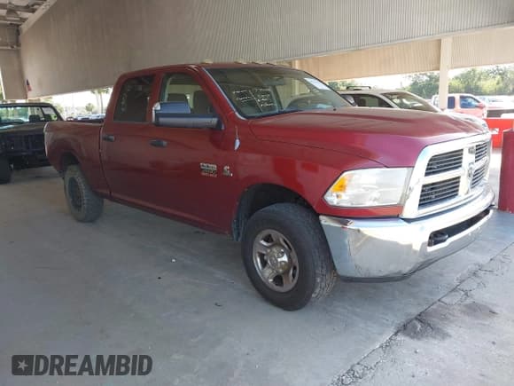 ✅ 2012 Ram 2500 ST • VIN: 3C6TD4CLXCG308864 • Lot: 42271179. Listed on IAAI with 153,668 mi. Free auction sales archive from the USA and detailed vehicle history report at DreamBid. Image 1.